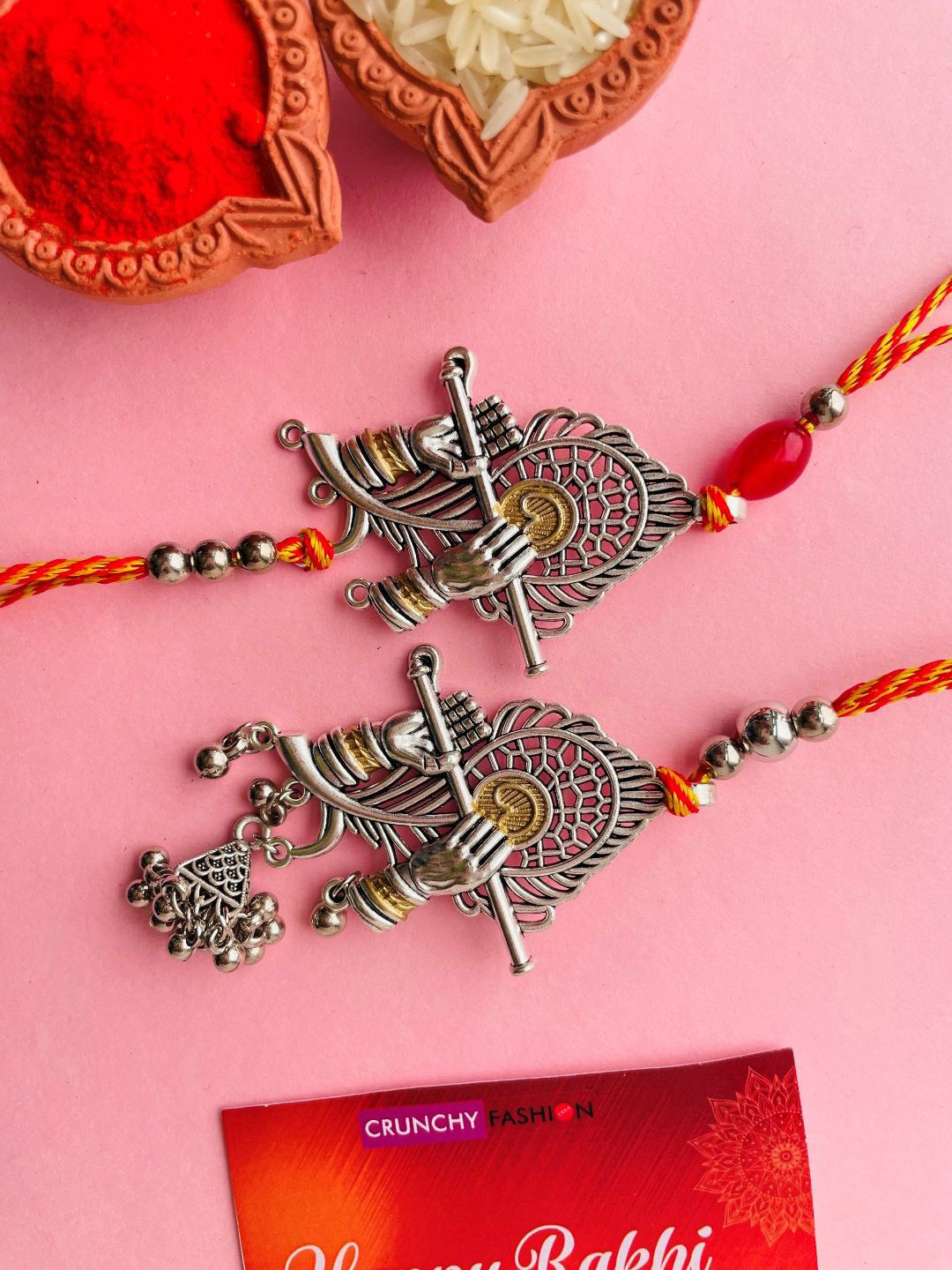 

Crunchy Fashion Bhaiya Bhabhi Oxidised Krishna Feather Thread Rakhi, Silver