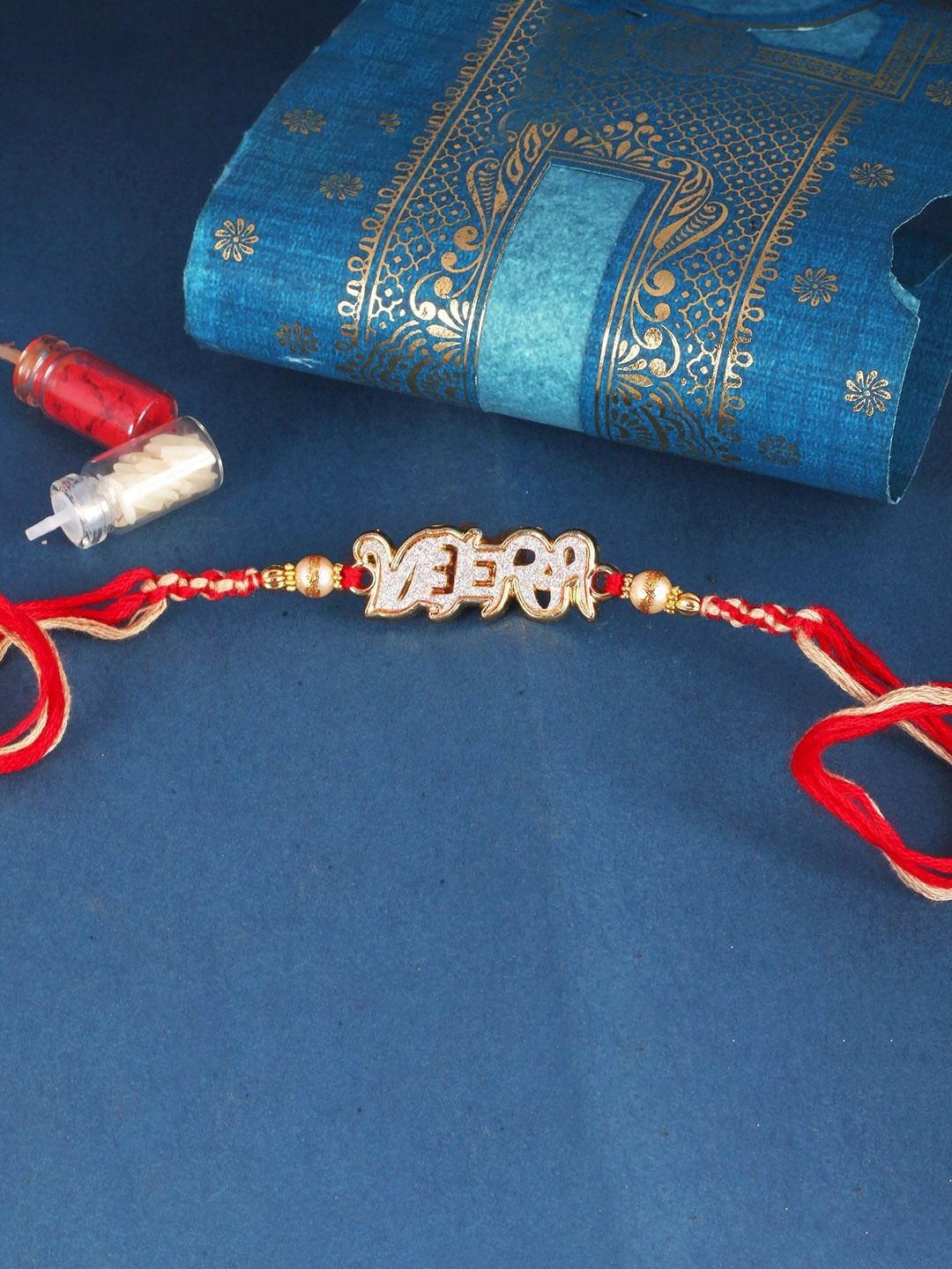 

Vighnaharta Set of 2 Gold and Rhodium Plated Evil Eye and Mera Bhai Thread Rakhis