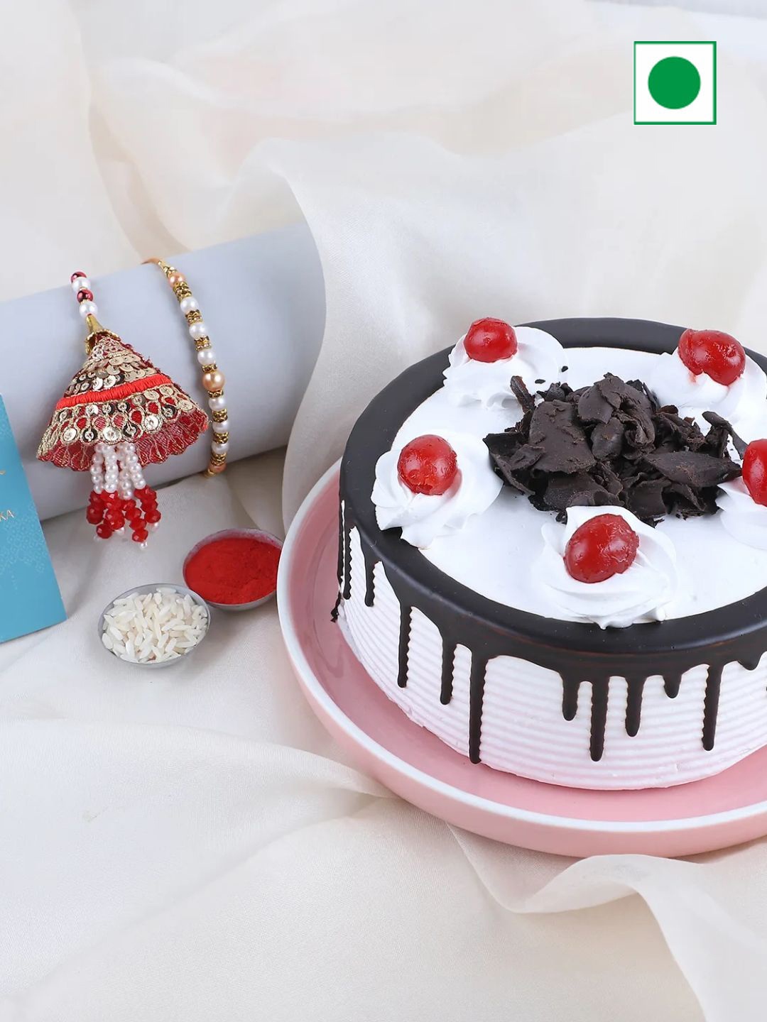 

fnp 2 Pcs Rakhi & Black Forest Cake with Roli and Chawal 500g, Red