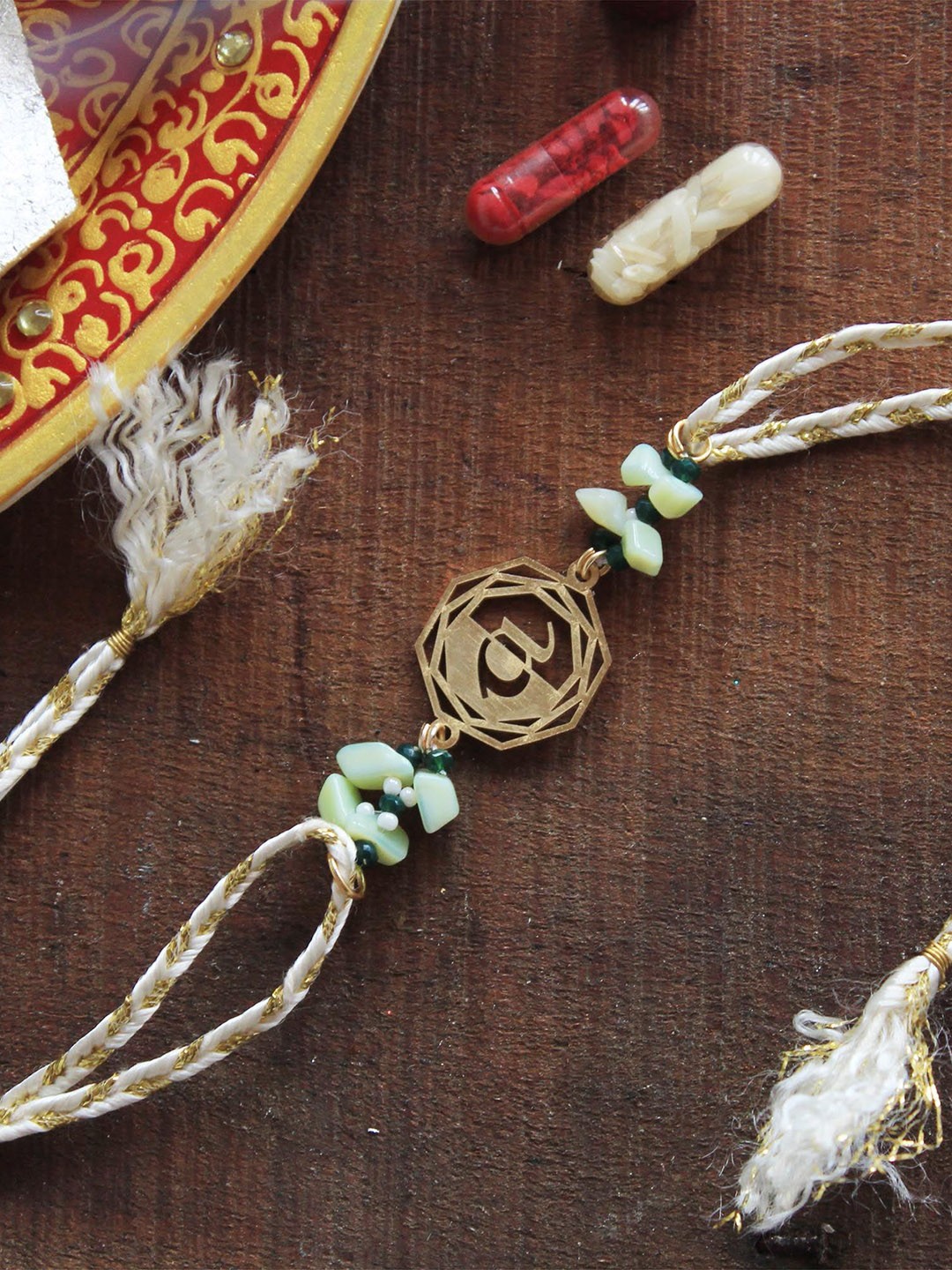

BeAbhika P Blooming Initial Thread Rakhi with Roli Chawal Capsules, Gold