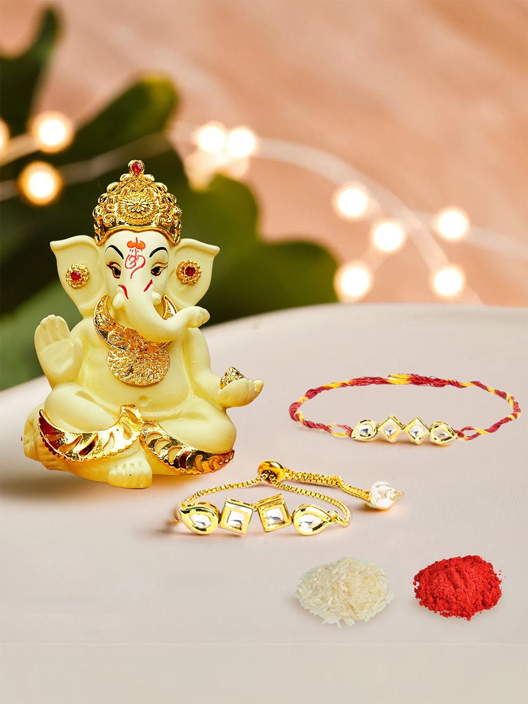 

Ekhasa Set Of 2 Rakhis With Roli Chawal & Ganesha Idol, Yellow