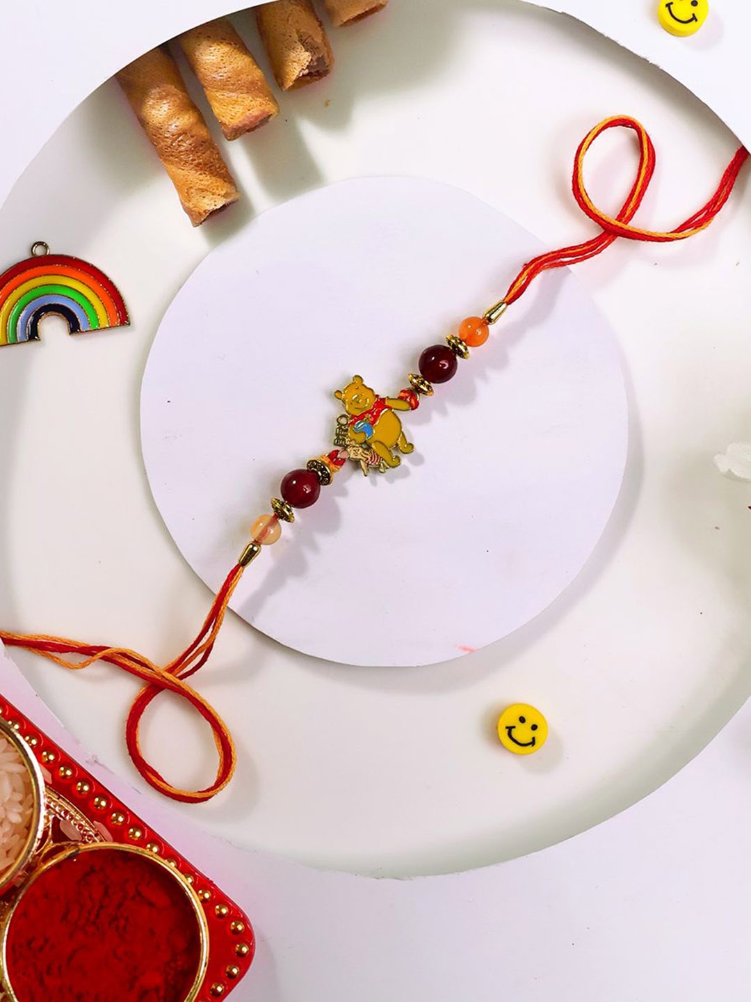 

Shubhanjali Kids Set Of 2 Winnie The Pooh Bro Rakhis With Roli Chawal & Greeting Card, Yellow