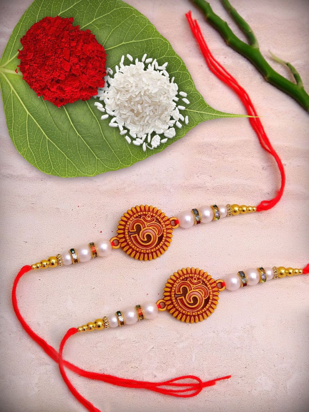 

Crunchy Fashion Set Of 2 Om Thread Rakhi, Red