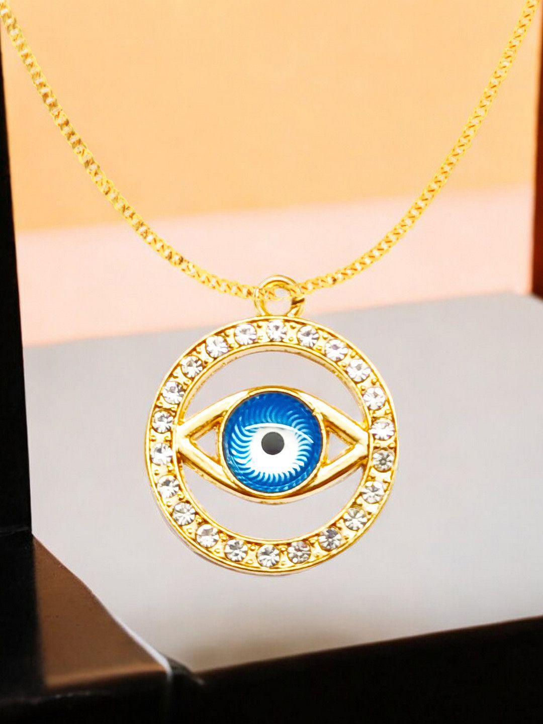

DressBerry Gold Toned Artificial Stones Evil Eye Pendant with Chain
