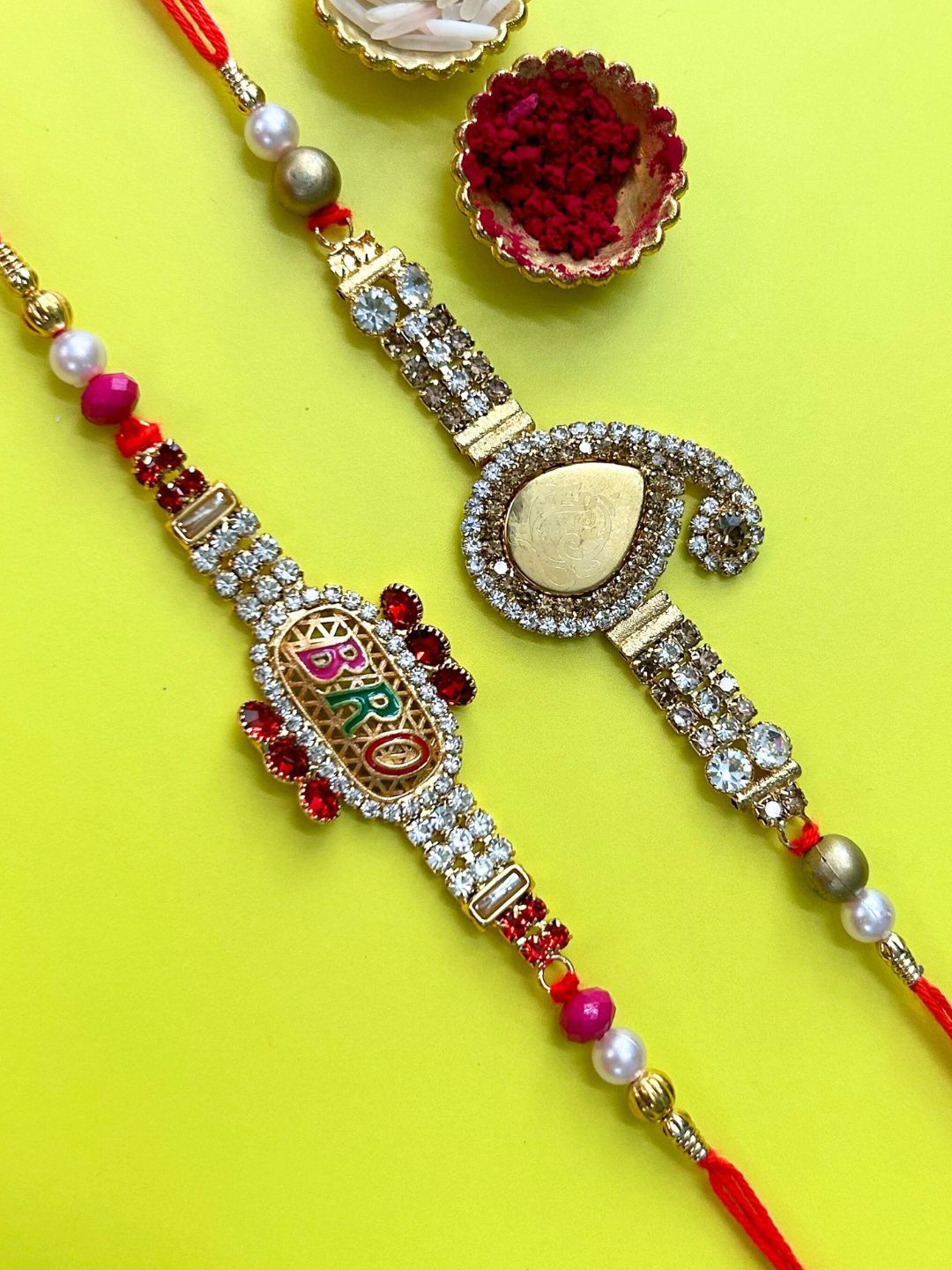 

LAIDA Set Of 2 Gemstone Studded & Beaded Thread Rakhis With Roli Chawal, Gold