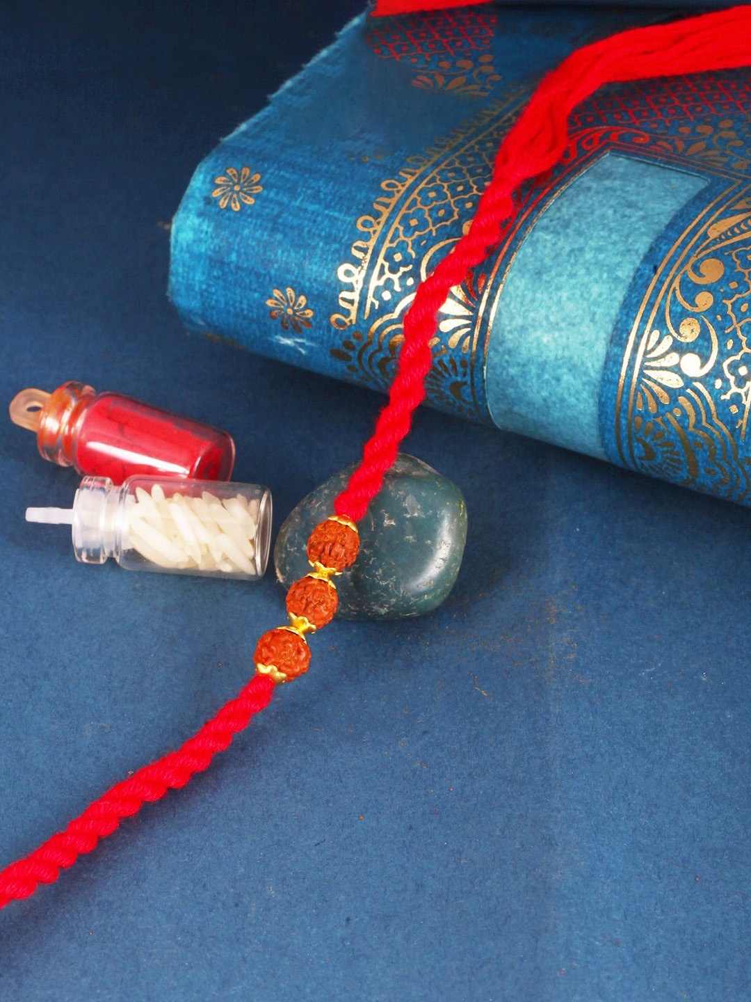

Vighnaharta Kids Set of 3 Gold and Rhodium Plated Fancy Pearls Rudraksha Thread Rakhis, Red
