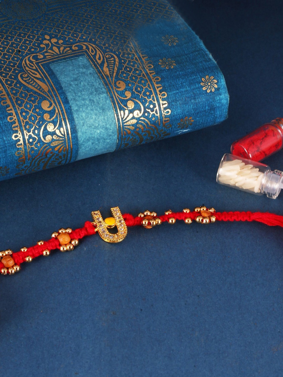 

Vighnaharta Kids Set of 3 Gold and Rhodium Plated Fancy Pearls Om Thread Rakhis, Red