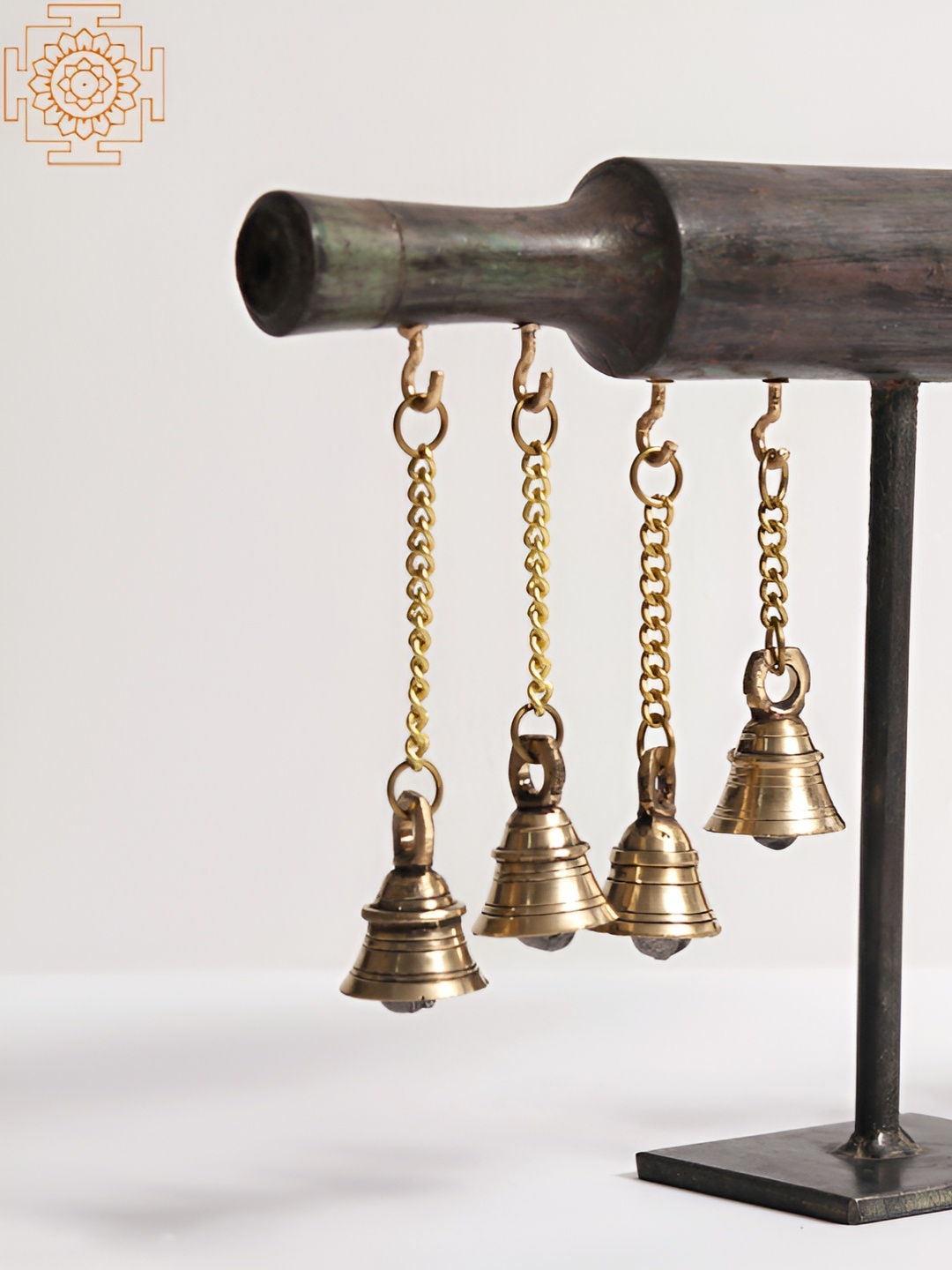 

Exotic India Gold-Toned Rolling Pin with Dangling Bells Showpiece