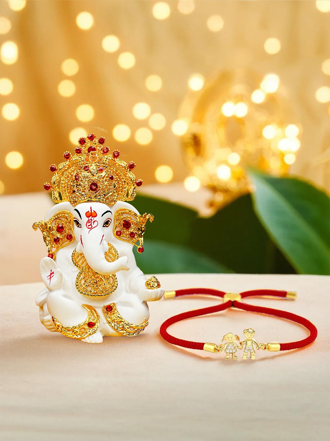 

Ekhasa Set Of 2 Brother Sister Rakhi With Ganesha Idol, Gold