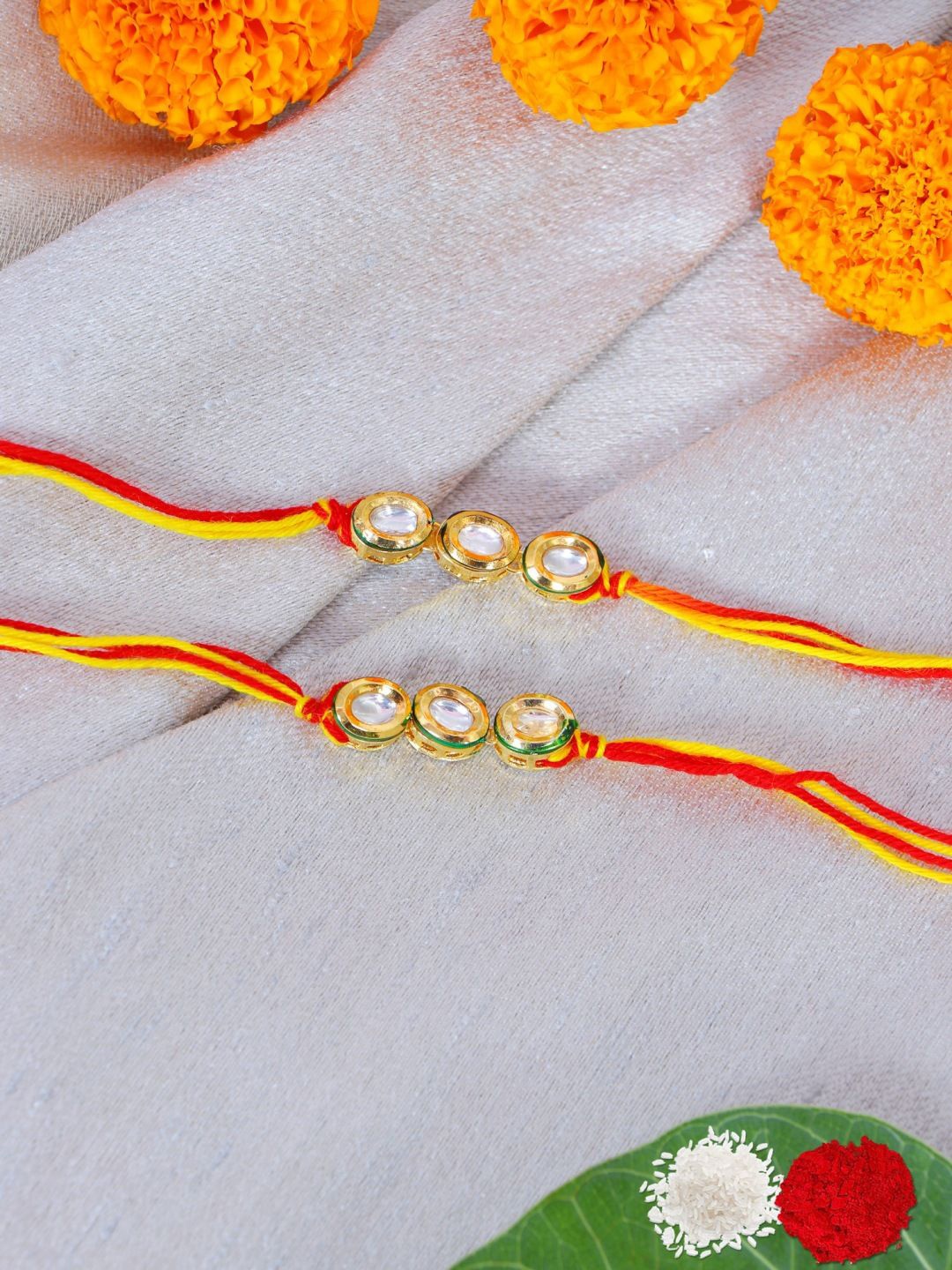 

Crunchy Fashion Kundan Studded Bhaiya Bhabhi Thread Rakhi With Roli & Chawal, White