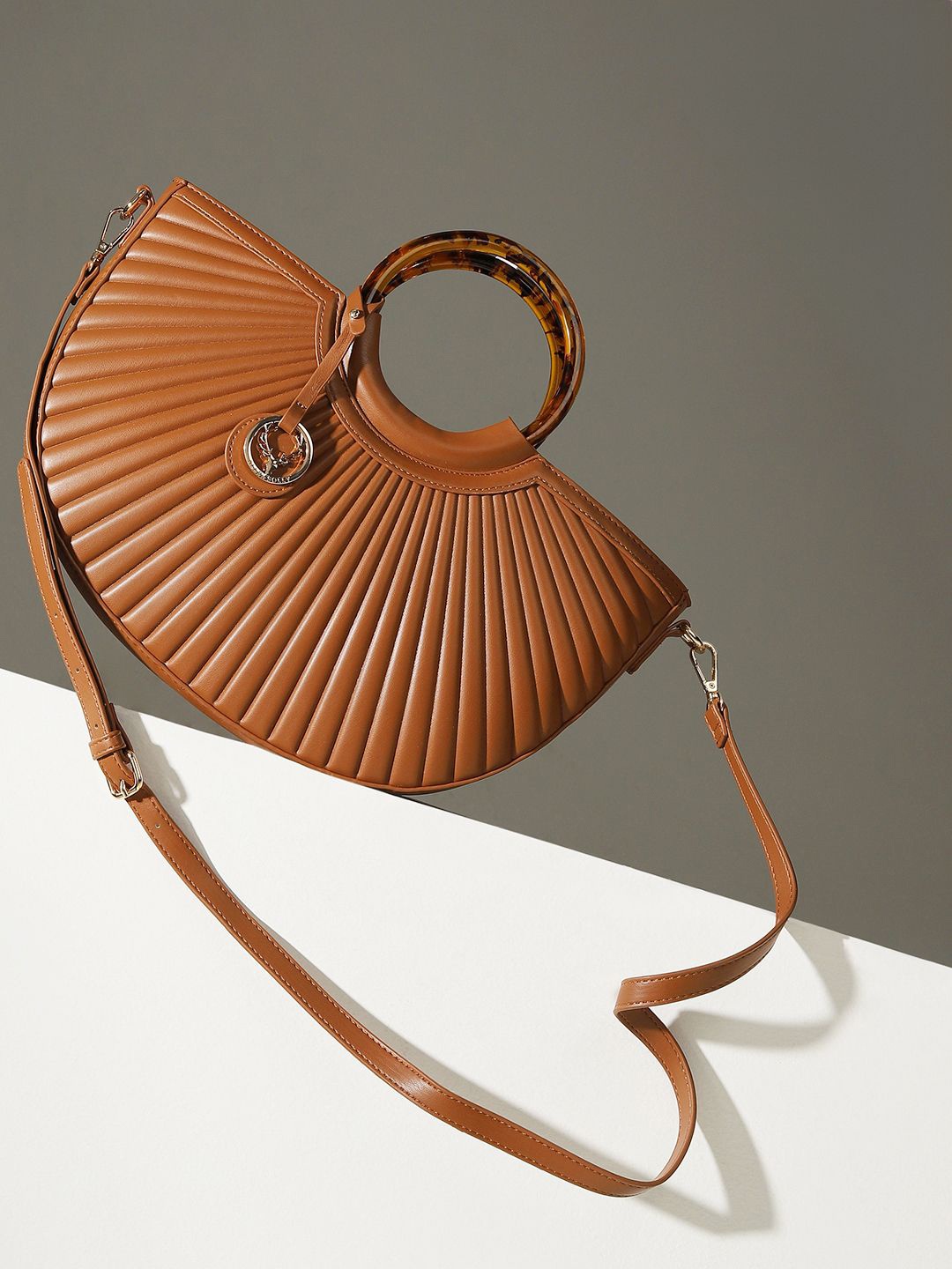 

Allen Solly Woman Textured Quilted Half Moon Sling Bag, Brown