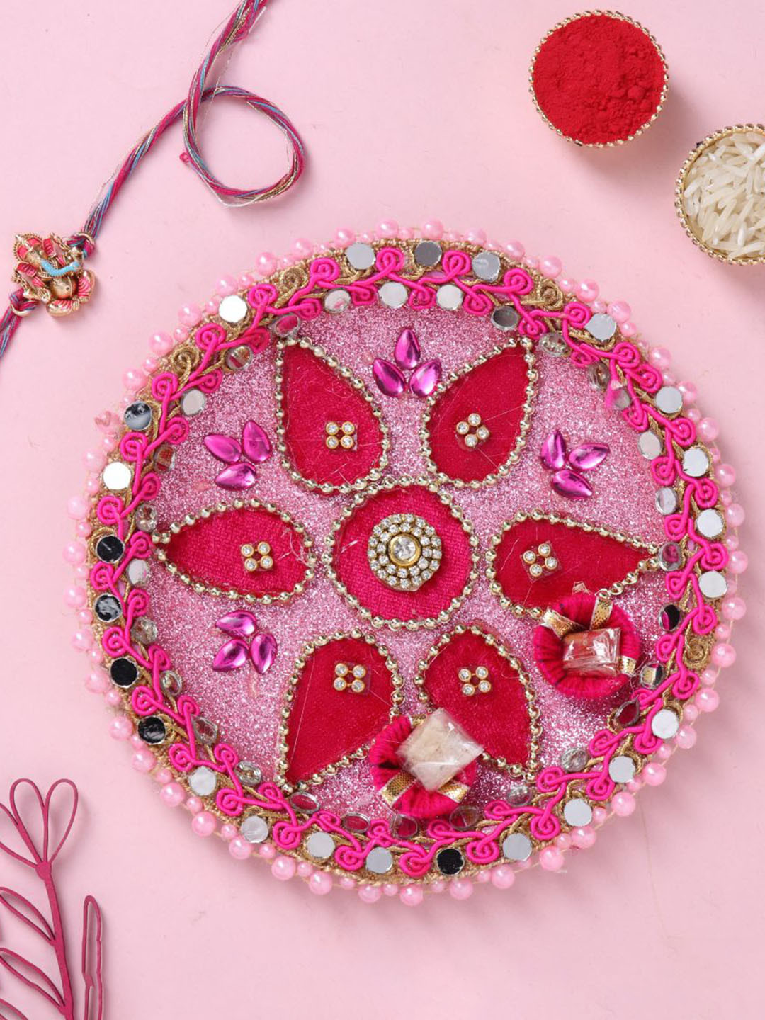 

Floweraura Set of 2 Ganesha Rakhi With Mirror Work Tika Thali, Pink