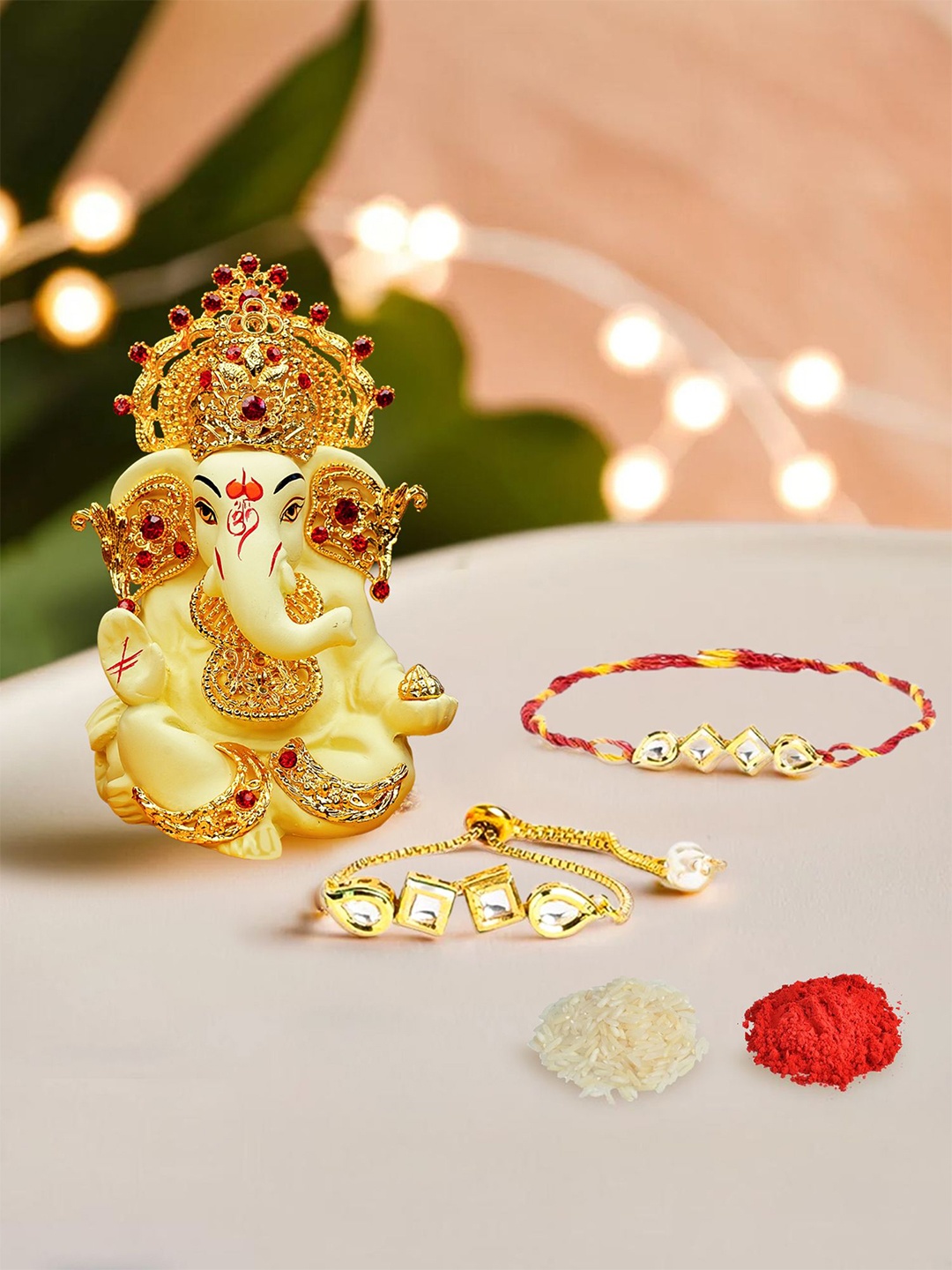 

Ekhasa Set Of 3 Kundan Studded Bhaiya Bhabhi Rakhi With Ganesha Idol, Gold