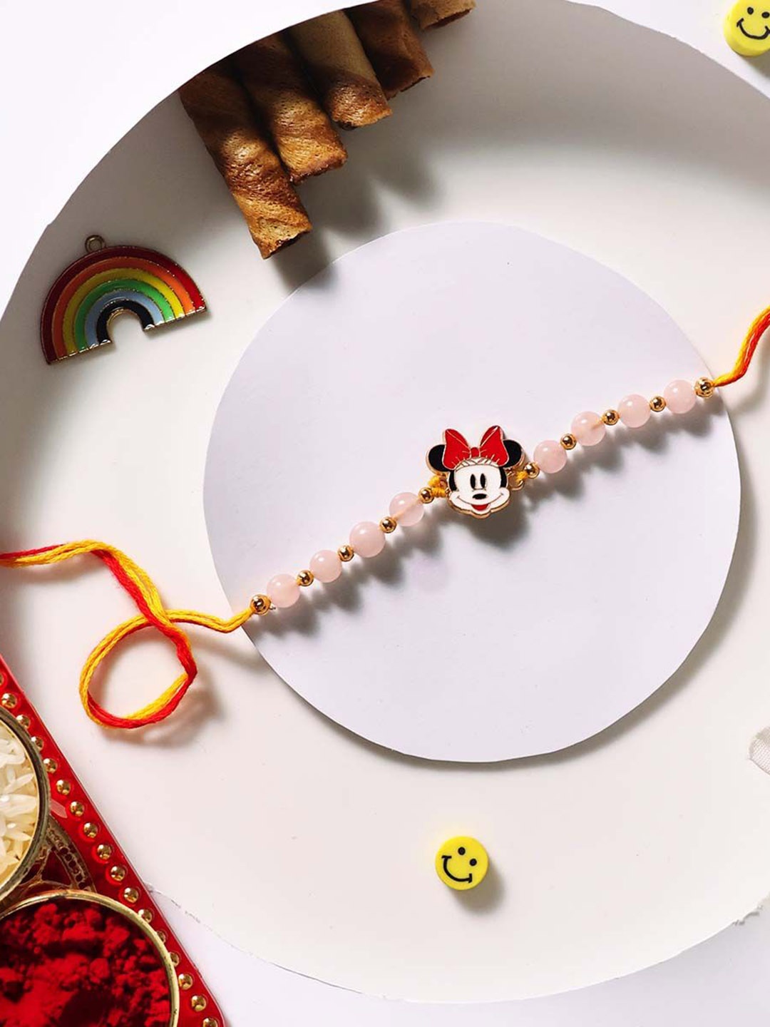 

Shubhanjali Set Of 2 Mini Mouse Rose Quartz Thread Rakhi With Roli Chawal & Greeting Card, Pink