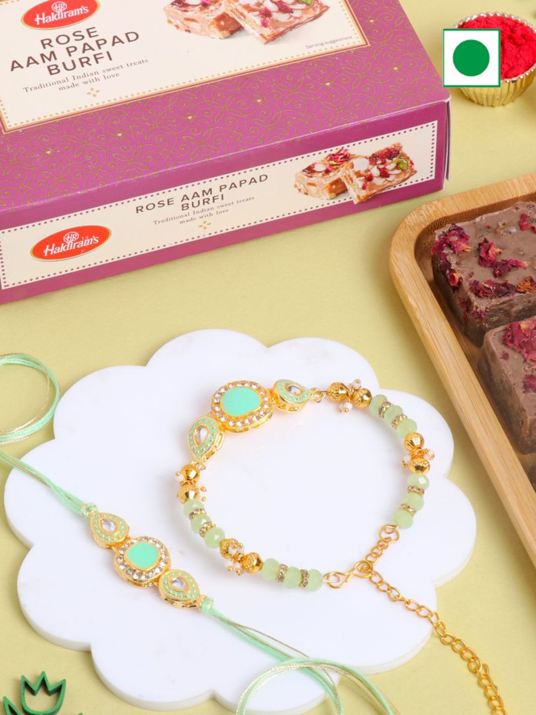 

Floweraura Set Of 2 Rakhi & Rose Almonds Aam Papad Barfi Gifts, Green