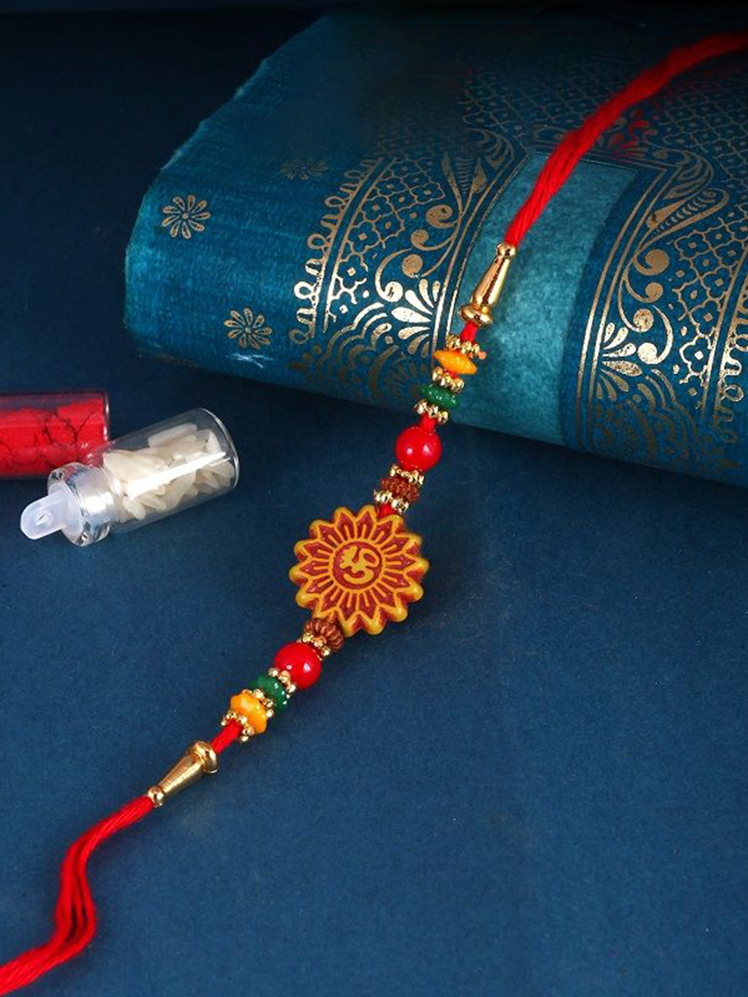 

Vighnaharta Kids Set of 3 Gold and Rhodium Plated Pearls Beaded & Om Thread Rakhis, Red