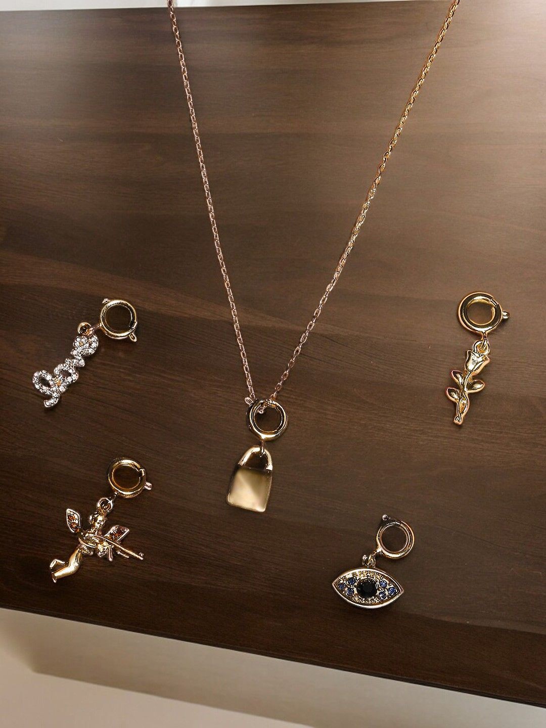 

DressBerry Set of 5 Gold Toned Artificial Stones Pendants with Chain