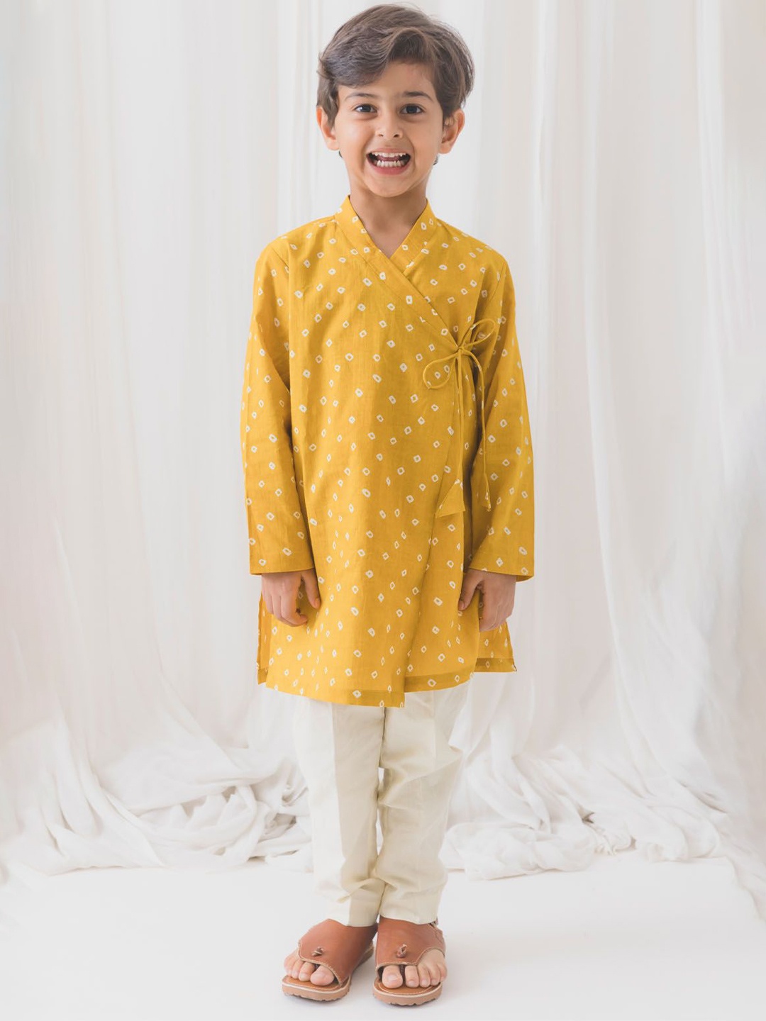 

Tiber Taber Boys Bandhani Printed Angrakha Pure Cotton Straight Kurta With Pyjamas, Yellow