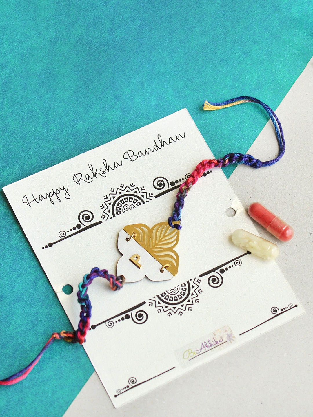 

BeAbhika Blooming Y Initial Beaded Thread Rakhi With Roli Chawal Capsules, White