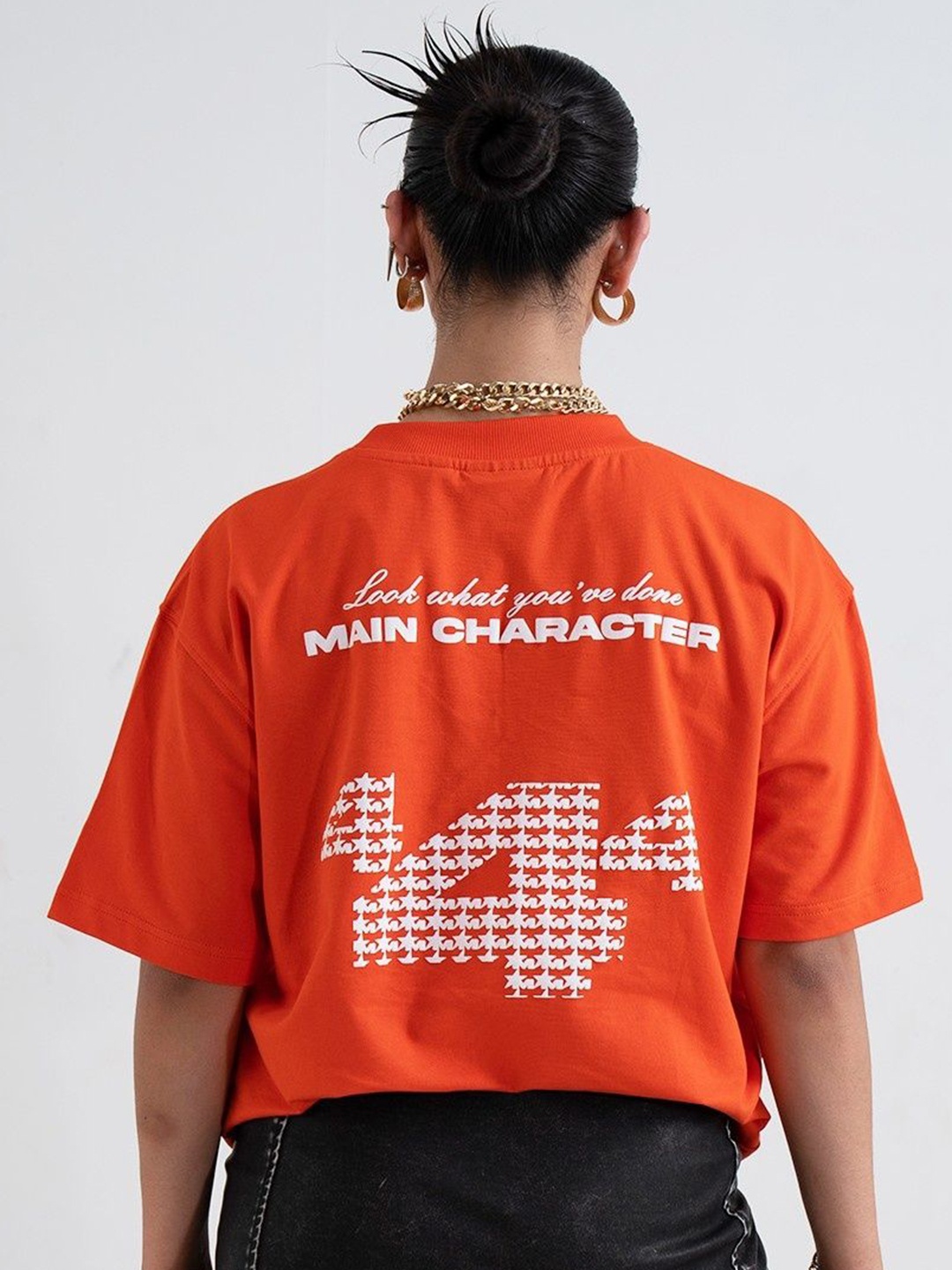 

Main Character India Unisex Typography Printed Drop-Shoulder Sleeves Pockets T-shirt, Orange