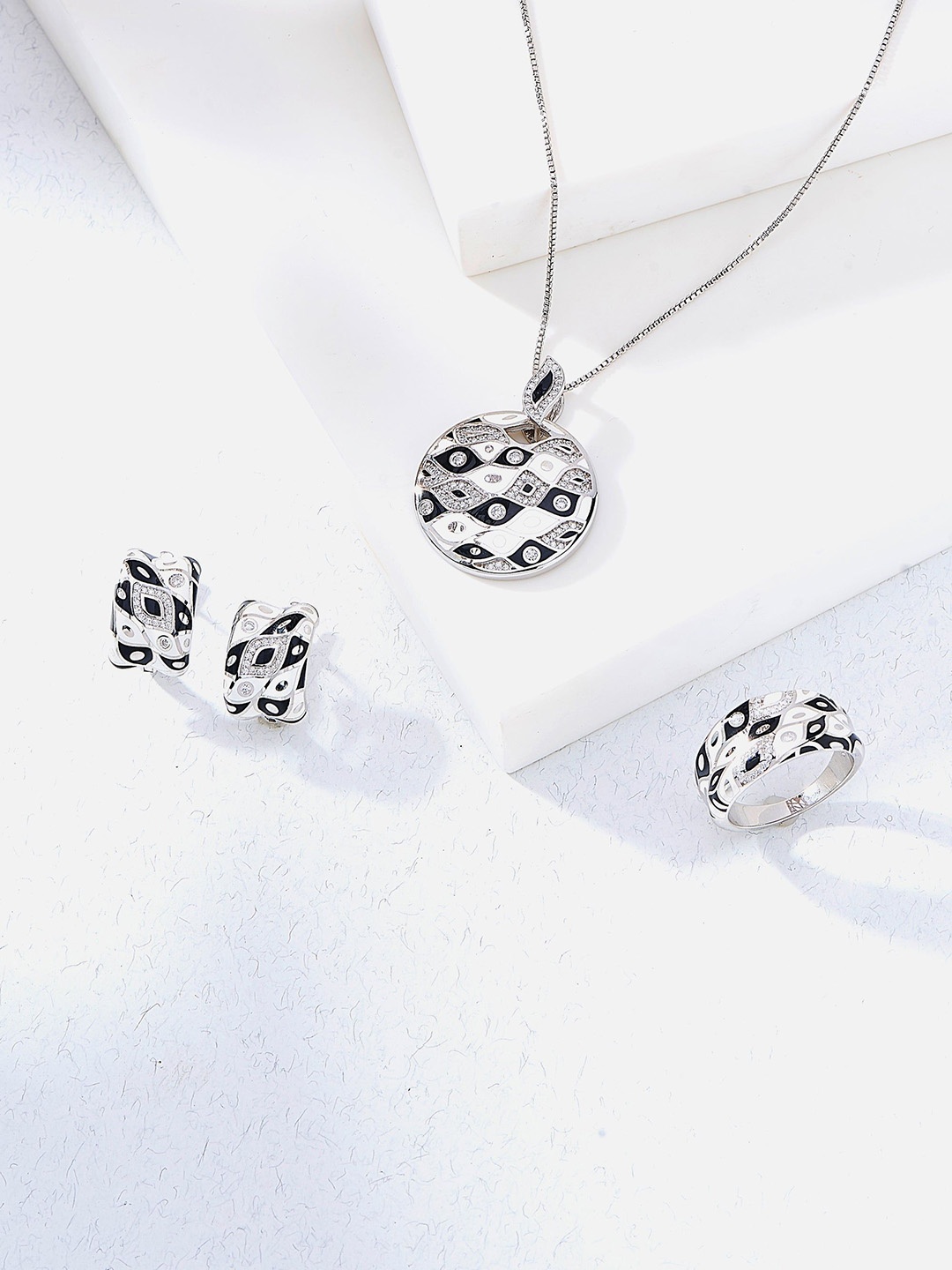 

Nipura Silver-Plated Circular Pendants with Chains