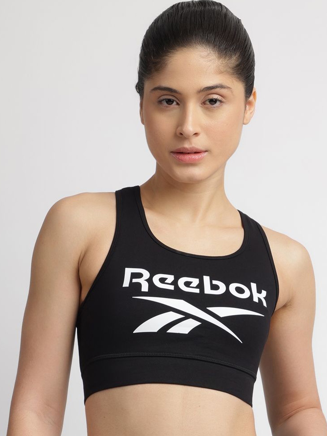 

Reebok Women All Day Comfort Brand Logo Printed Sports Bra, Black