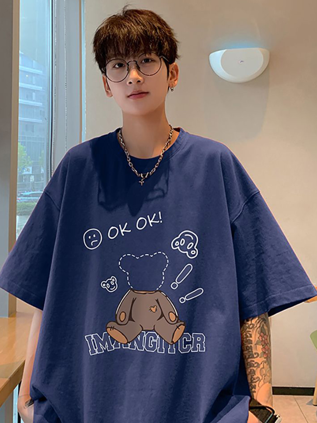 

StyleCast x Revolte Men Graphic Printed Round Neck Cotton Oversized T-shirt, Navy blue