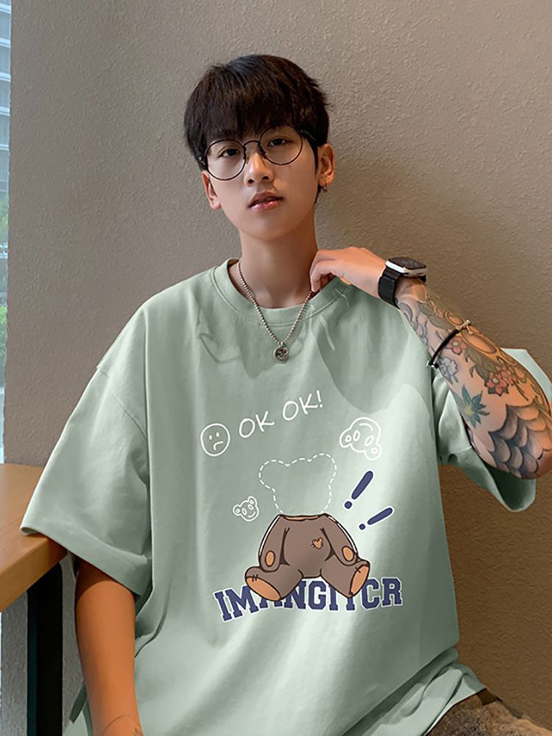 

StyleCast x Revolte Men Graphic Printed Round Neck Cotton Oversized T-shirt, Green