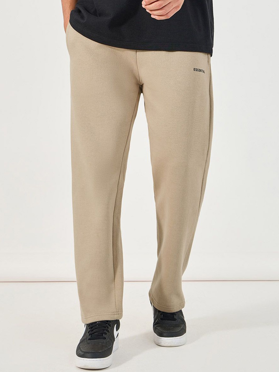 

Styli Men Open Hem Relaxed Fit Jogger with Minimal Print, Beige