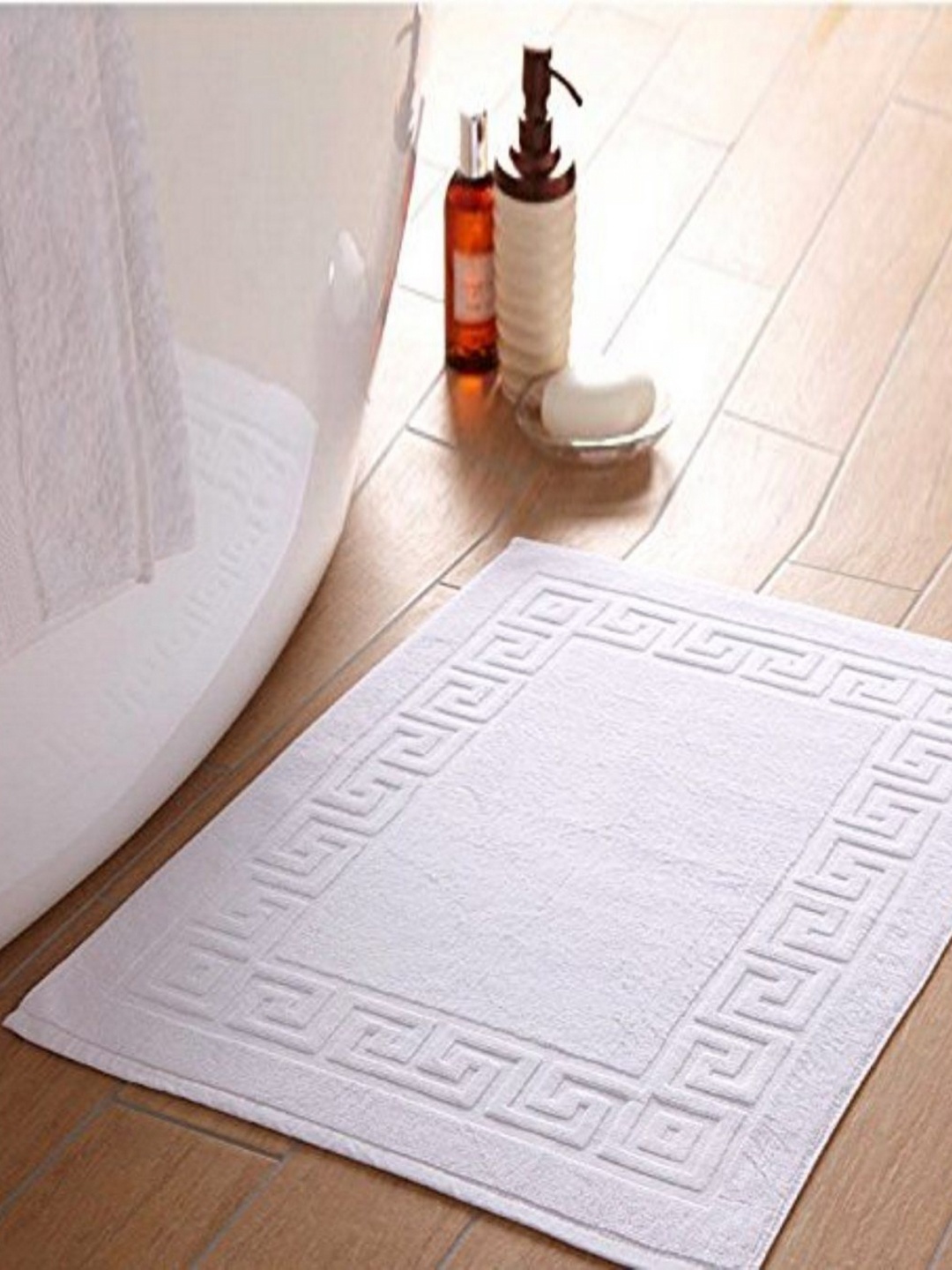 

Lushomes White Textured 300 GSM Rectangle Shaped Anti-Skid Cotton Bath Rug