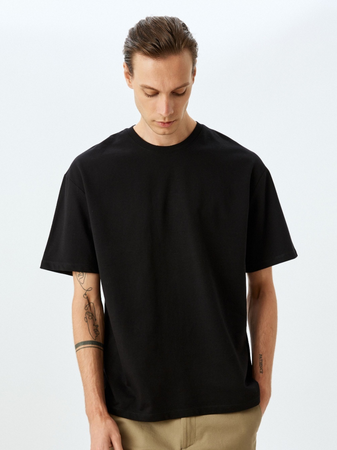 

Koton Men Solid Round Neck T-shirt, Black