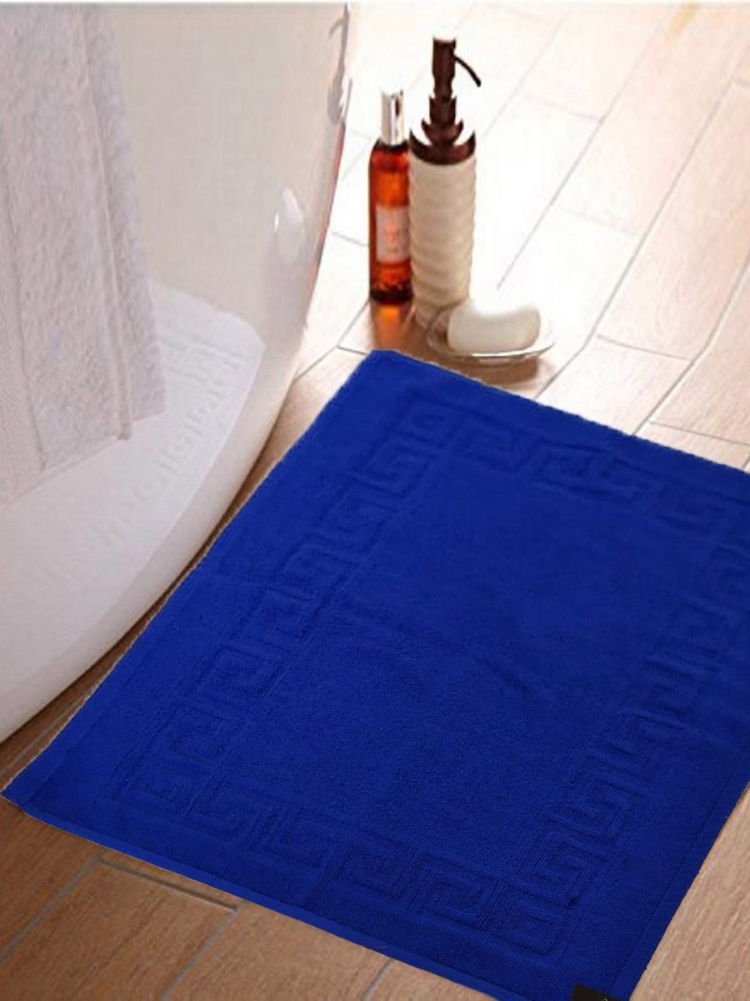 

Lushomes Blue Textured 300 GSM Rectangle Shaped Anti-Skid Cotton Bath Rug