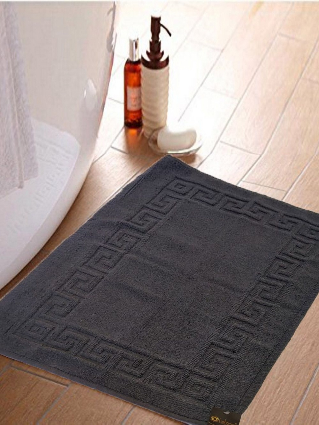 

Lushomes Grey Textured 300 GSM Rectangle Shaped Anti-Skid Cotton Bath Rug