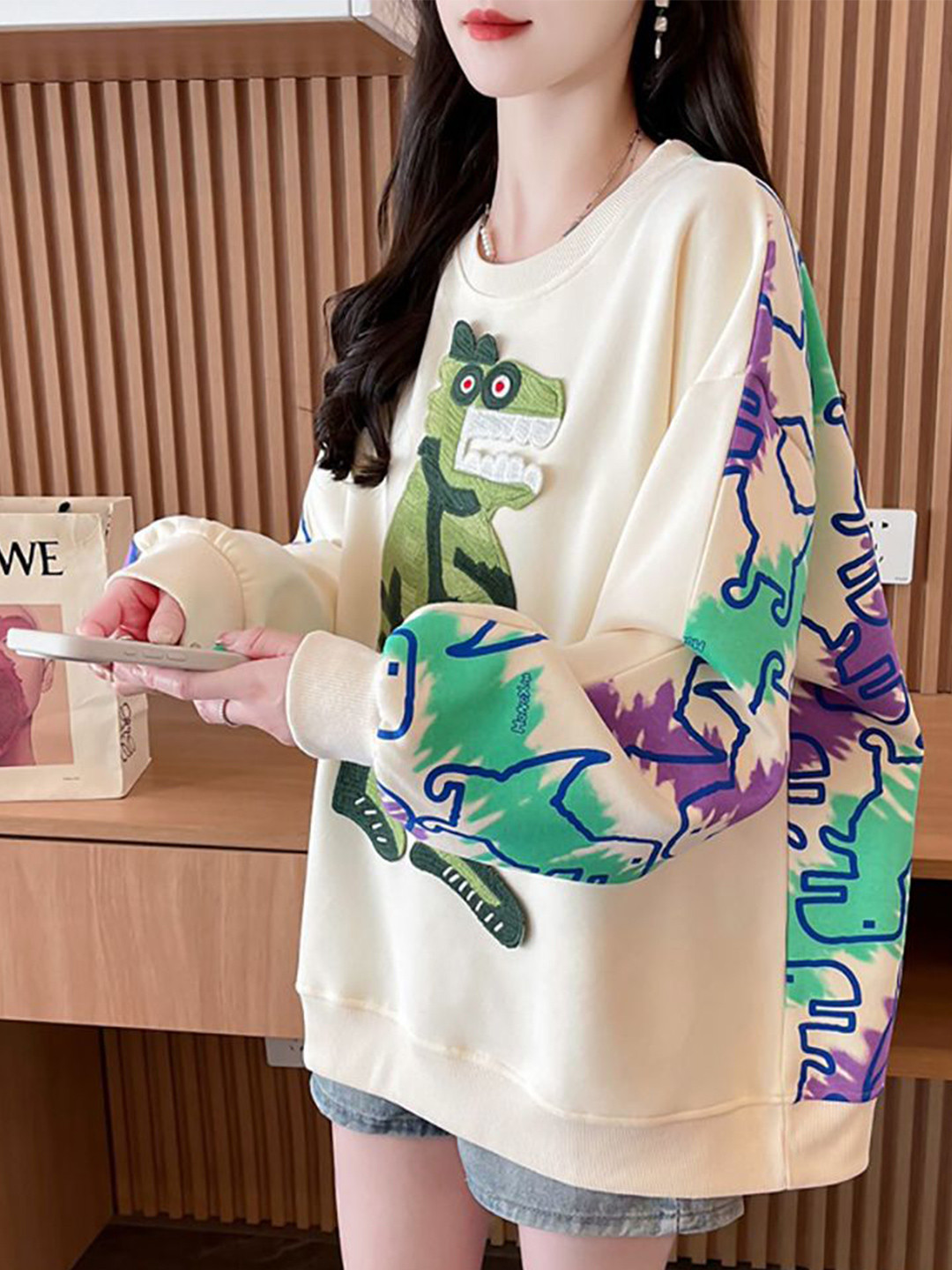

StyleCast x Revolte Women Printed Round Neck Oversized Sweatshirt, Beige