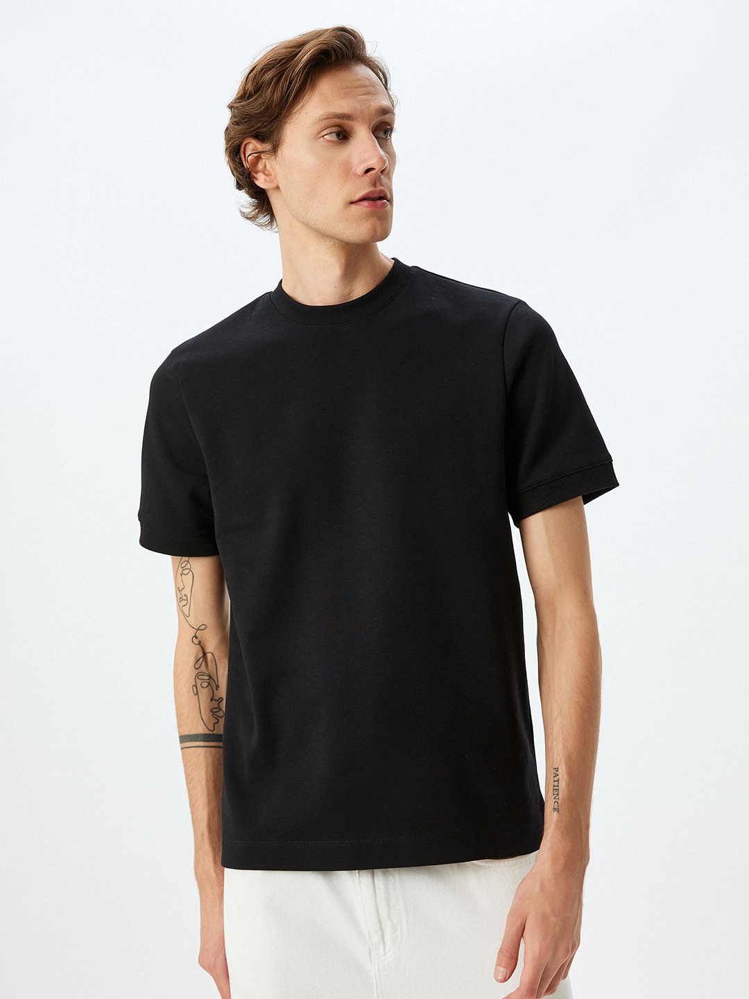 

Koton Men Solid Round Neck Cotton T-shirt, Black