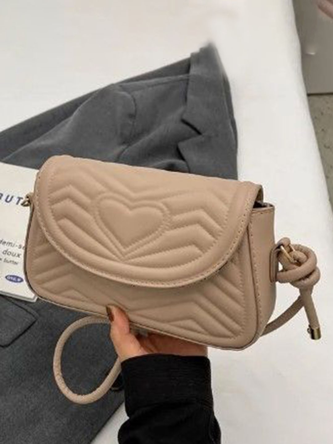 

StyleCast Textured Bucket Handheld Bag with Tasselled, Beige