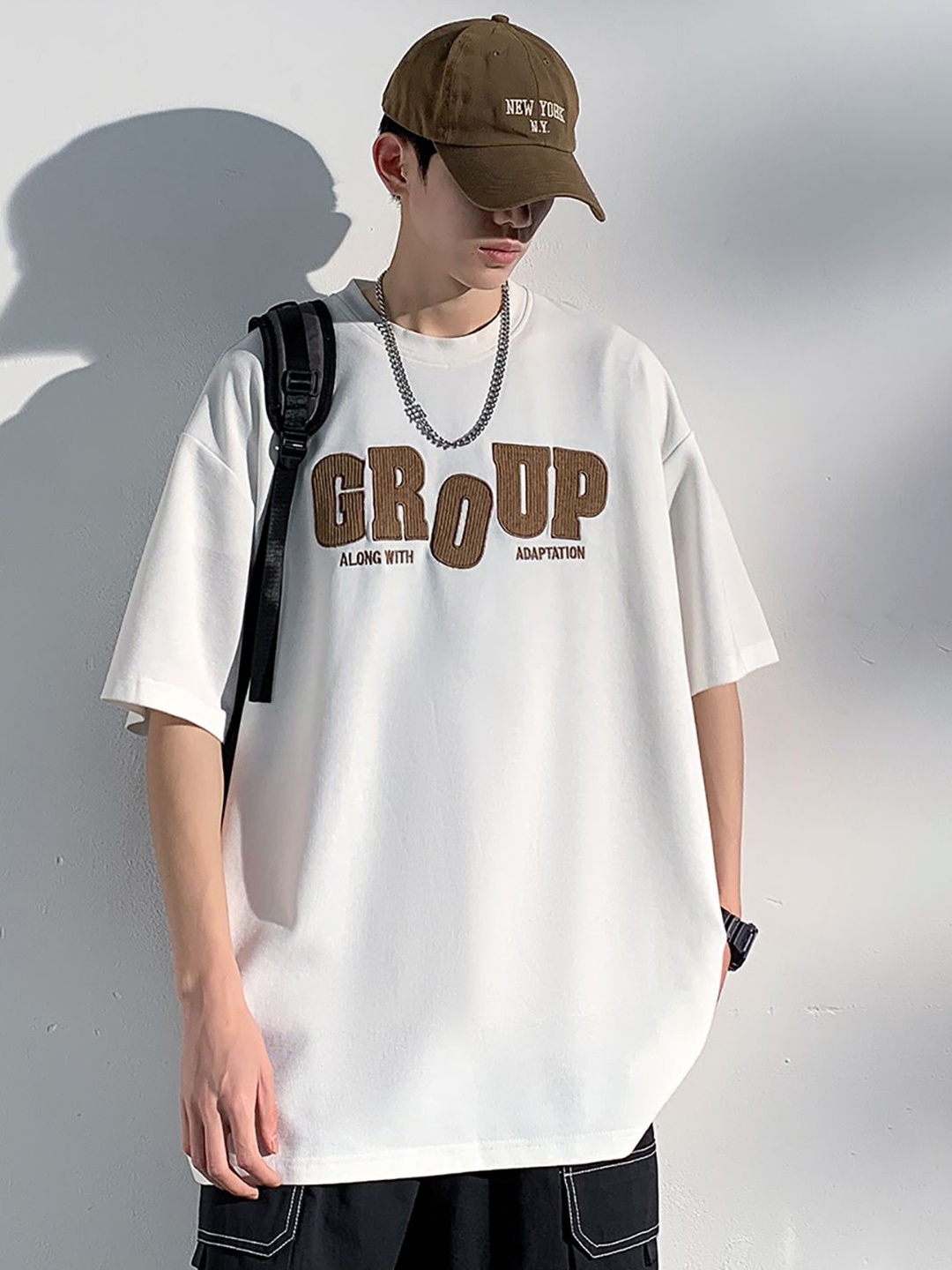

StyleCast x Revolte Men Typography Printed Round Neck Oversized T-shirt, White