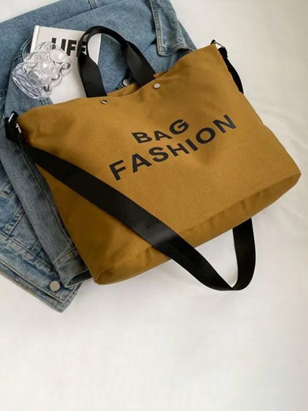 

StyleCast Printed Structured Handheld Bag with Tasselled, Khaki