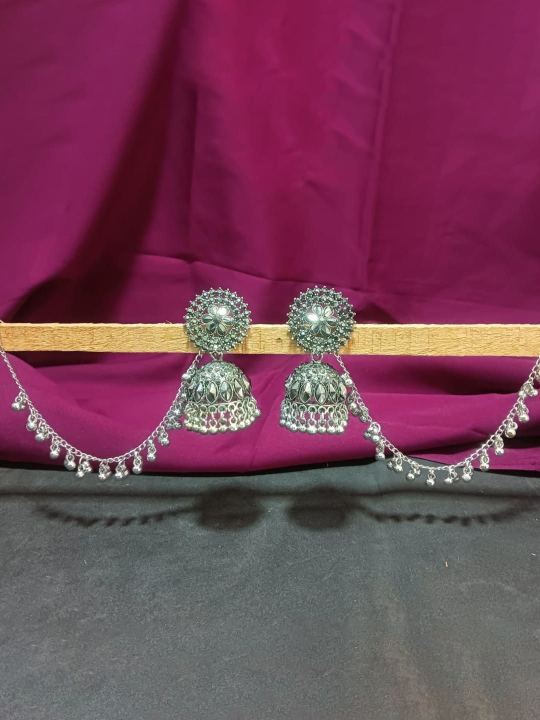 

Efulgenz Rhodium-Plated Oxidised Contemporary Jhumkas With Ball Charm Hair Chain, Silver