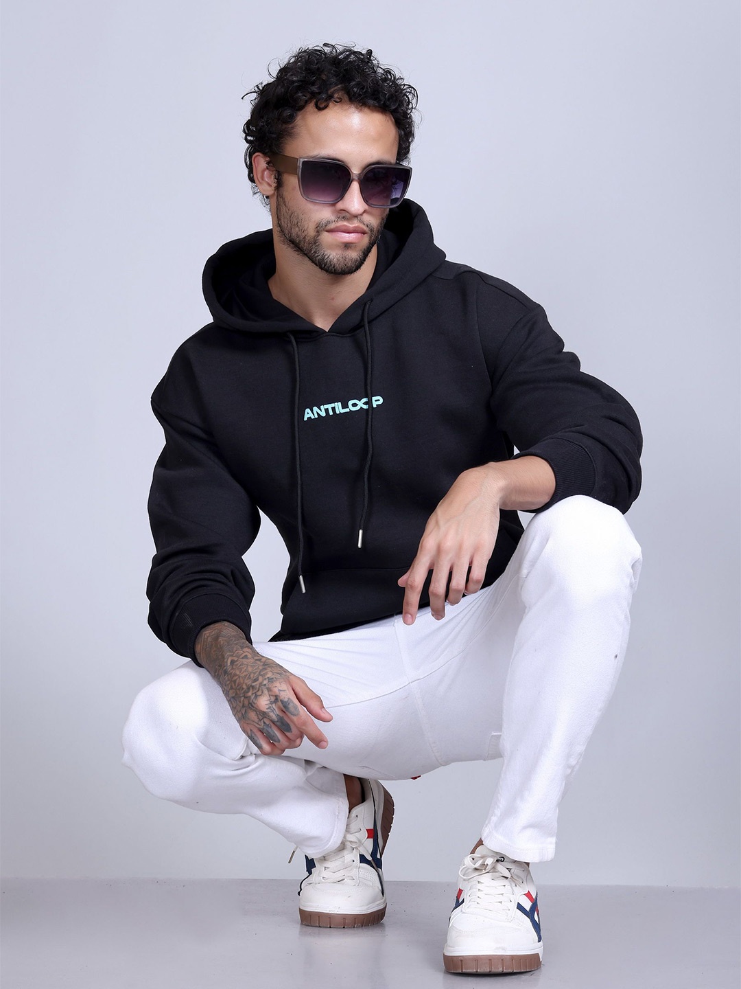 

Antiloop Men Printed Drop Shoulder Hooded Sweatshirt, Black