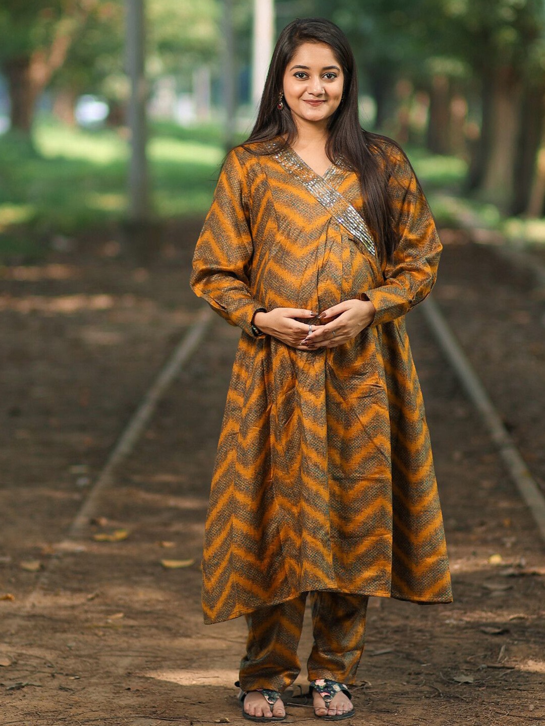 

Aujjessa Women Angrakha Sequinned Kurta with Trousers, Mustard
