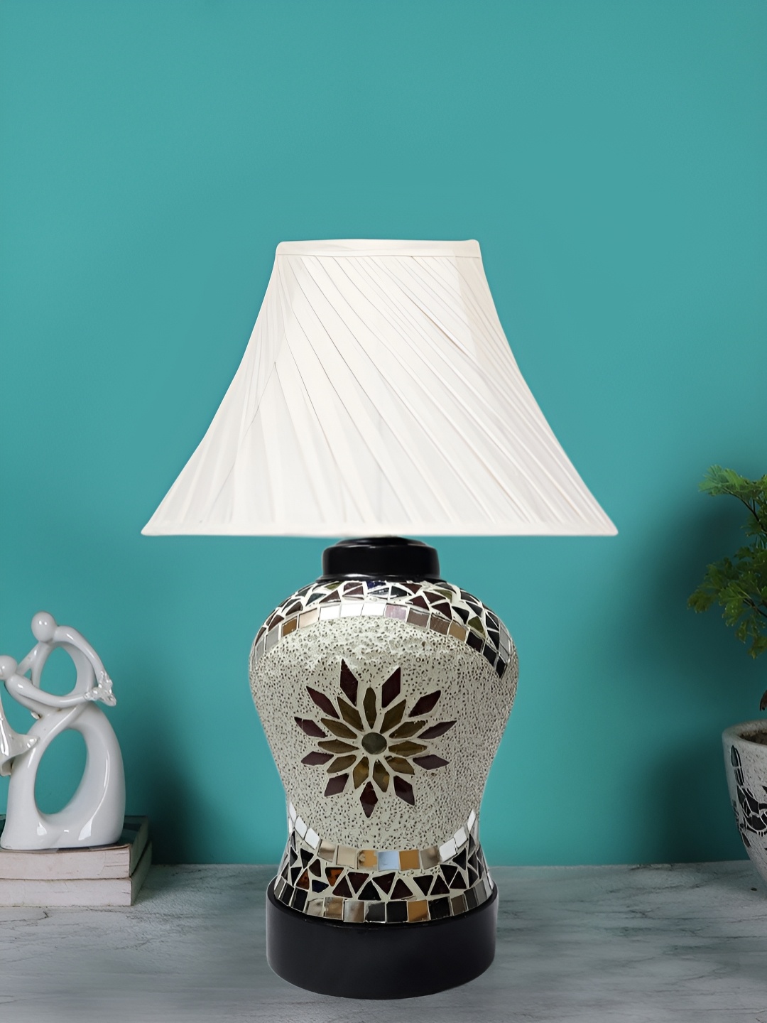 

Devansh Off White Textured Glass Contemporary Frusturical Shaped Table Lamp