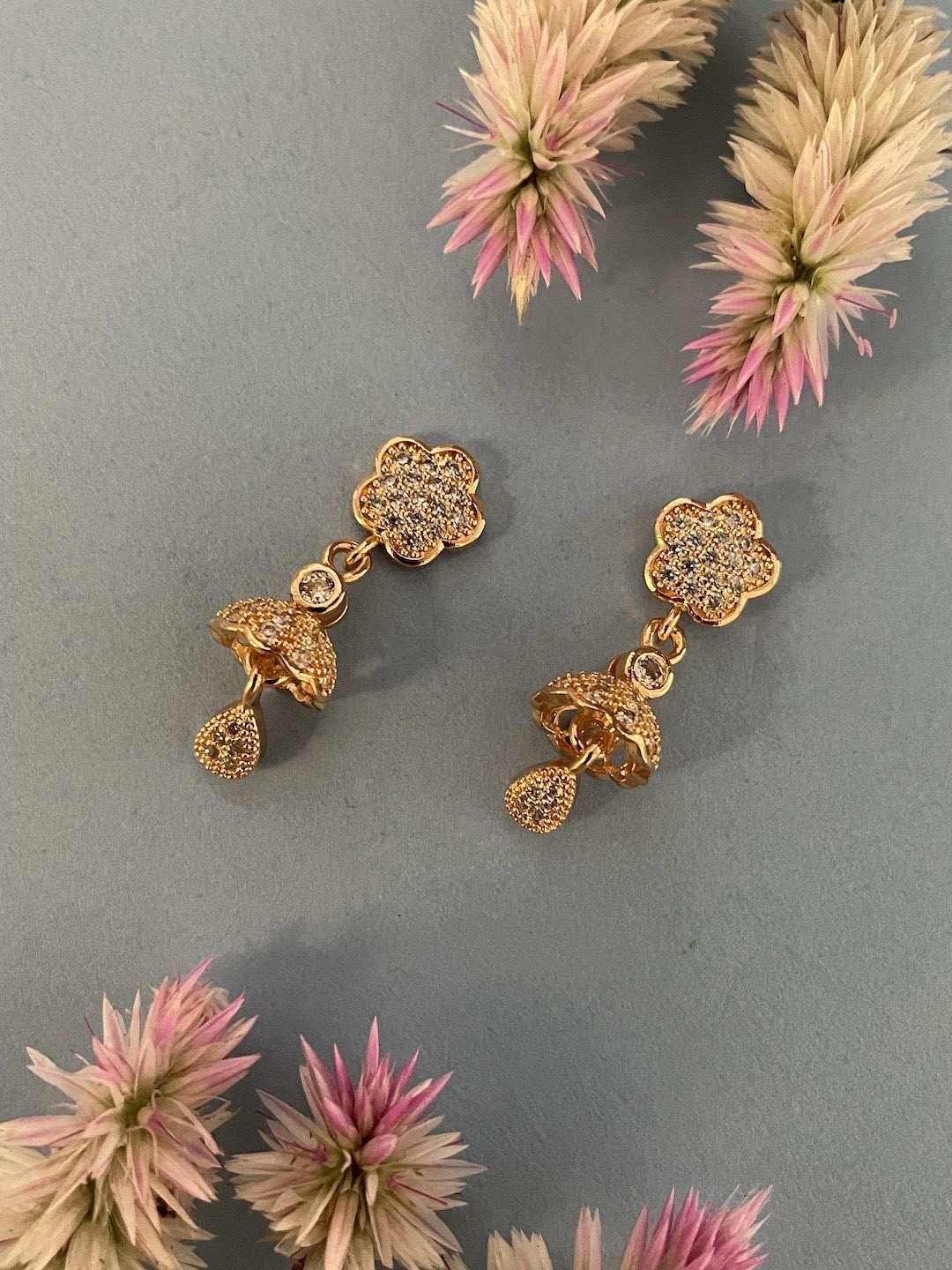 

Digital Dress Room Gold-Plated White AD-Studded Jhumkas Earrings