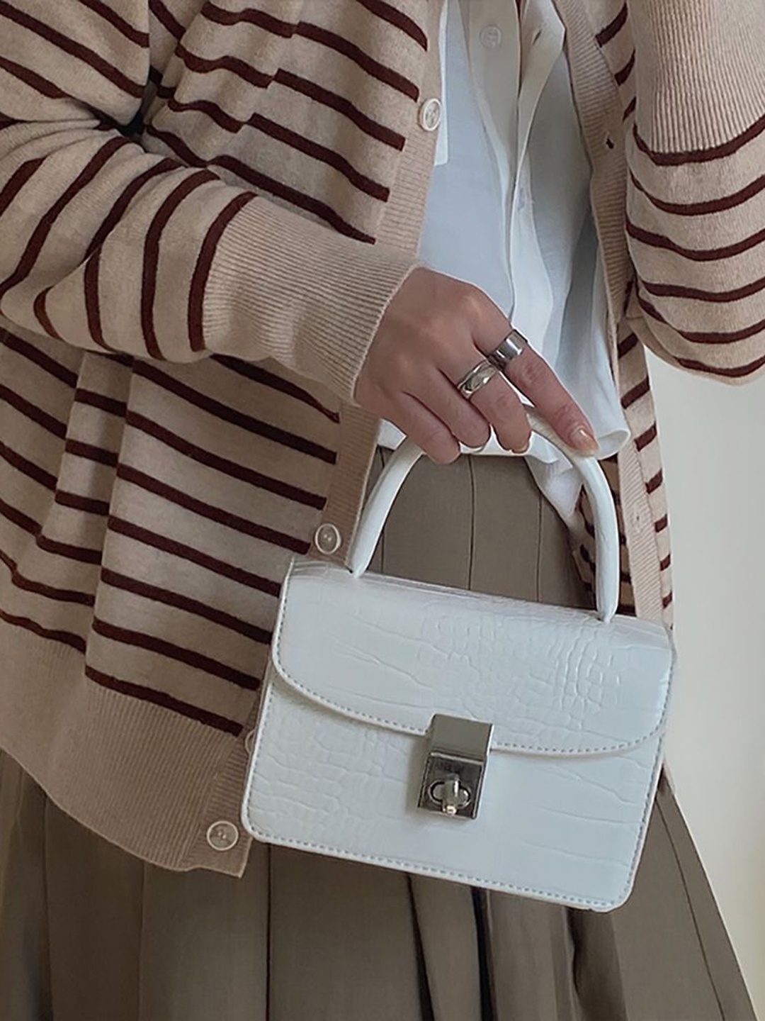

StyleCast x Revolte Textured PU Sling Bag, White
