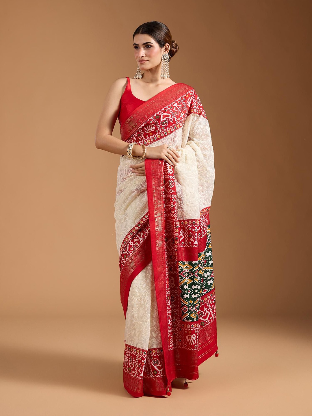 

Jinal & Jinal Woven Design Zari Pure Georgette Patola Saree, White