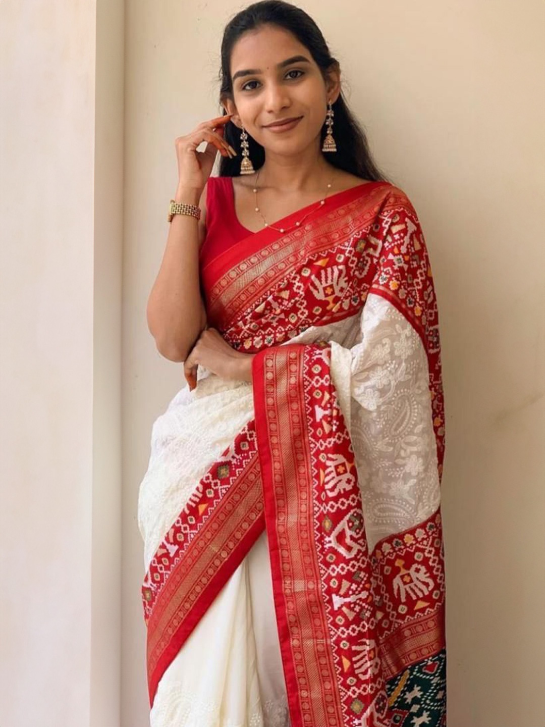 

Jinal & Jinal Ethnic Motifs Chikankari Pure Georgette Designer Patola Saree, White