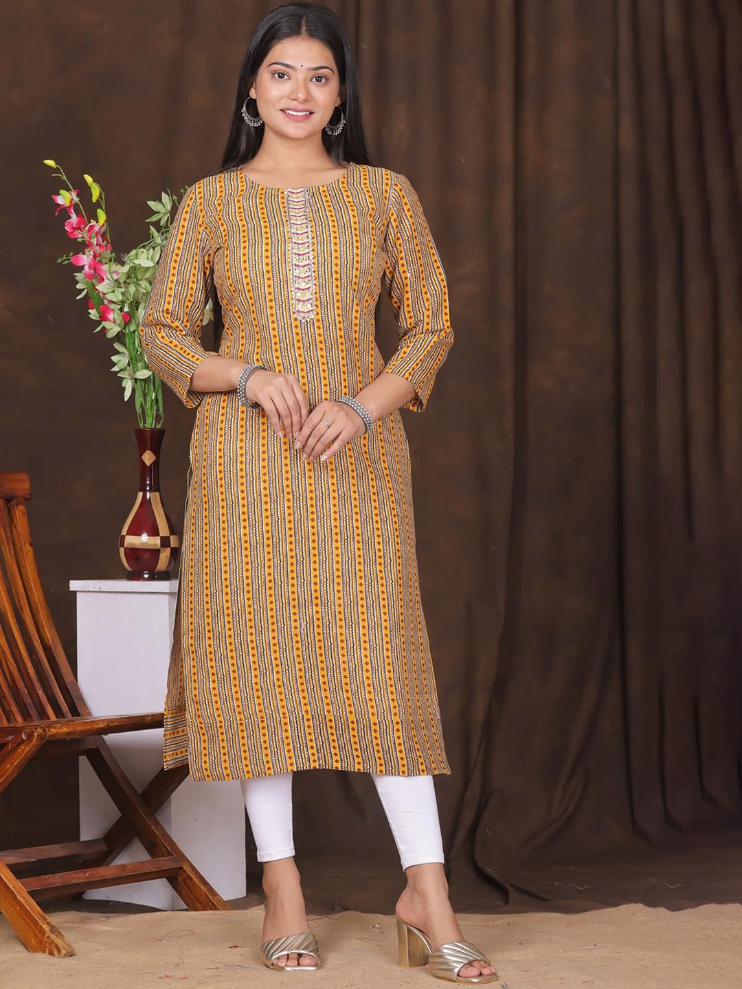 

Kairab Women Striped Flared Sleeves Thread Work Kurta, Yellow