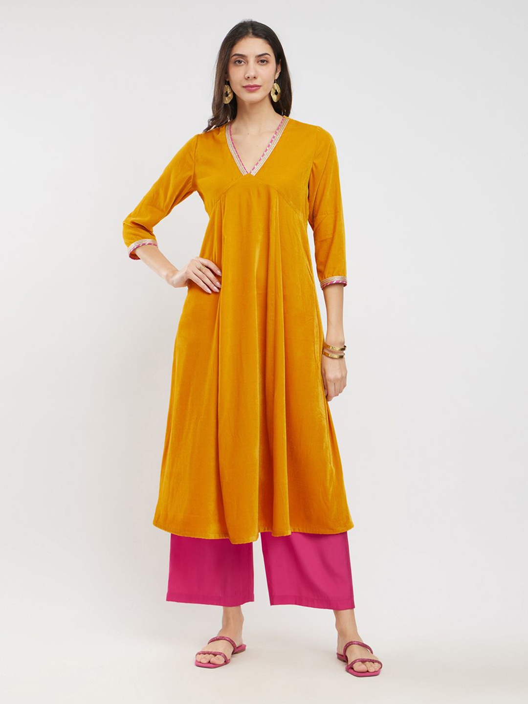 

Pink Fort Women Regular Velvet Kurta with Trousers, Yellow