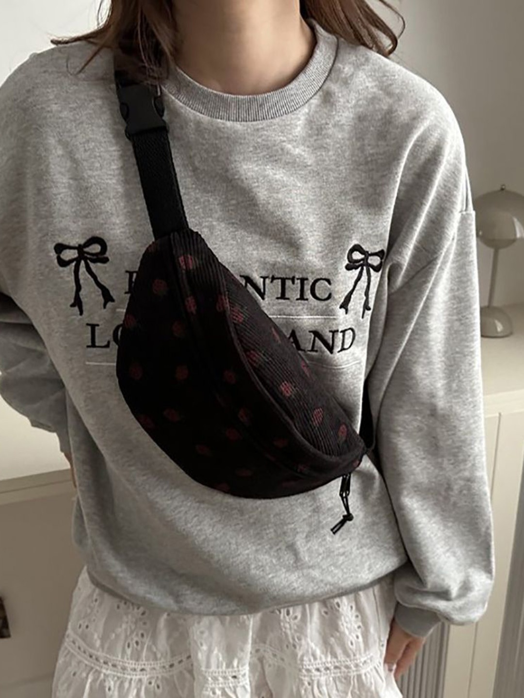 

StyleCast x Revolte Printed Sling Bag, Black