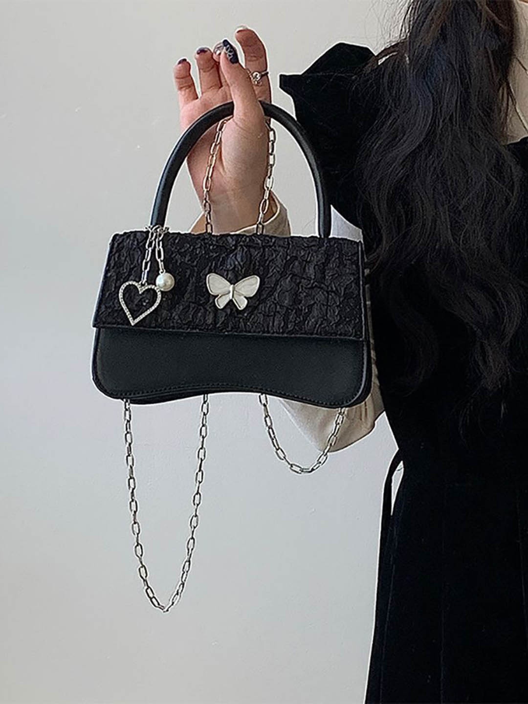 

StyleCast x Revolte PU Structured Sling Bag with Applique, Black